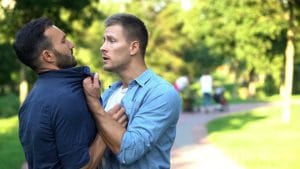 One man threatening another with assault